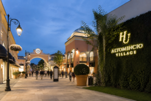 hu Altomincio Village near Lake Garda at sunset with elegant pedestrian area and visitors walking